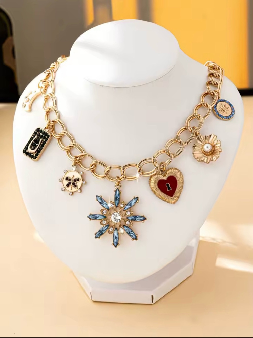 Gold-Tone Charm Necklace with Blue Crystal Star and Red Heart